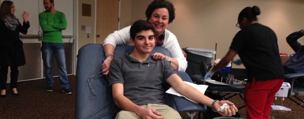 Justin's mom, Carol Pfau, is proud of her son's commitment to giving blood. Photo by Elana Goldenberg.