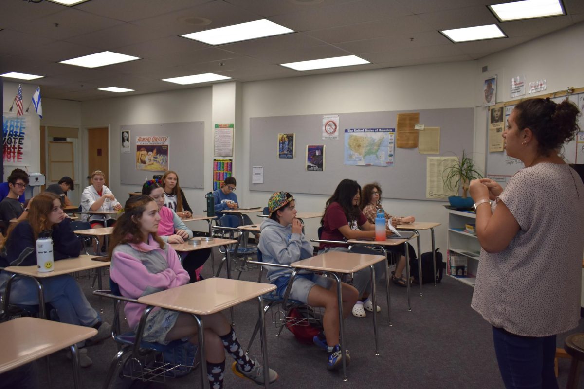 Flacks teaching 11th and 12th graders Jewish studies class, preparing them for their trip to Israel in the spring