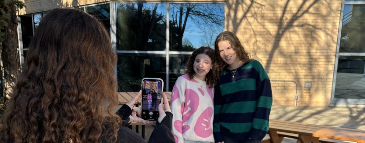 Gabrielle Sosland taking a picture of Orli Zigler and Dani Glickman on Lapse.