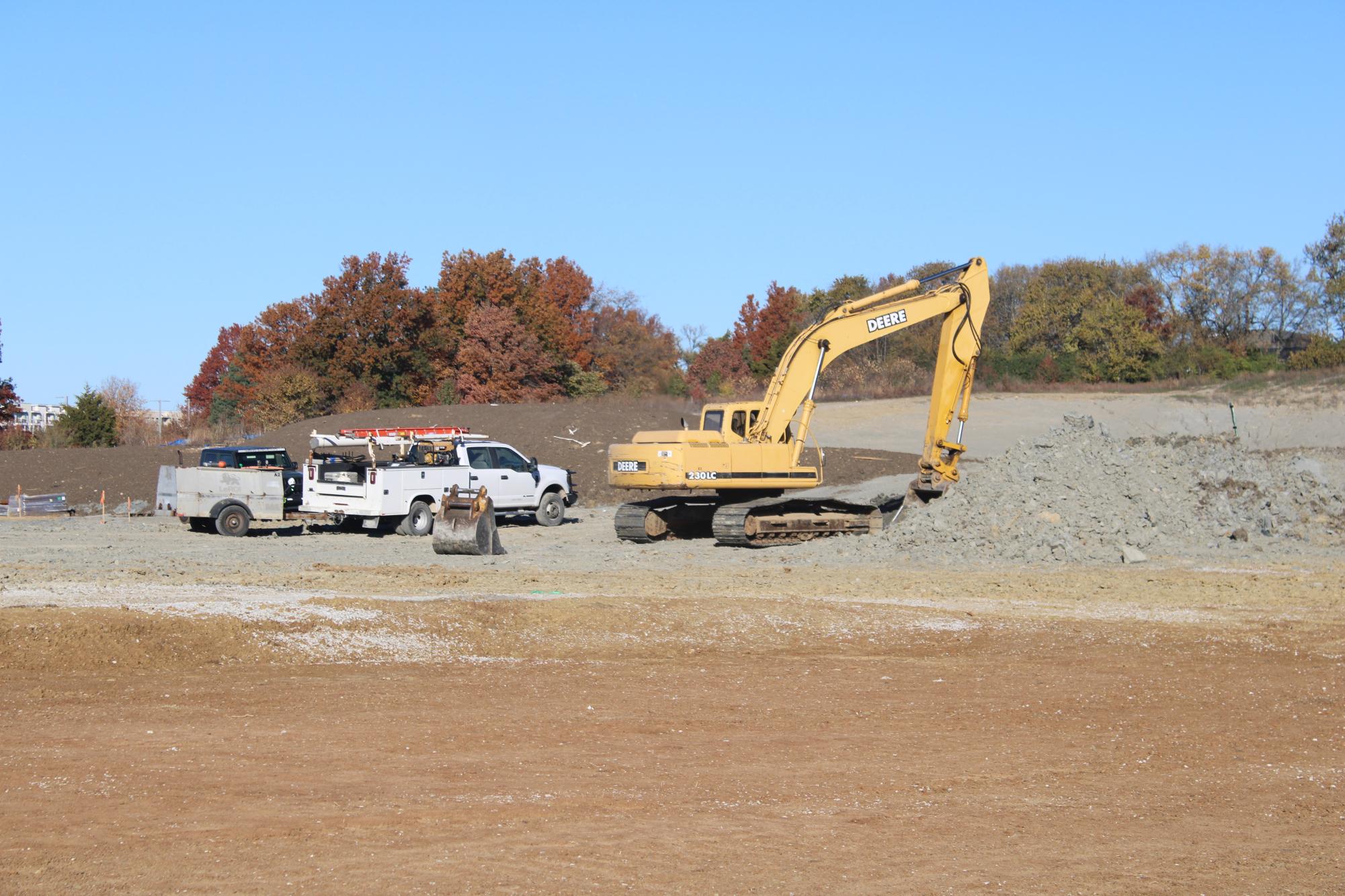 Piles of dirt with the excavator. Image by Skyler Penner.