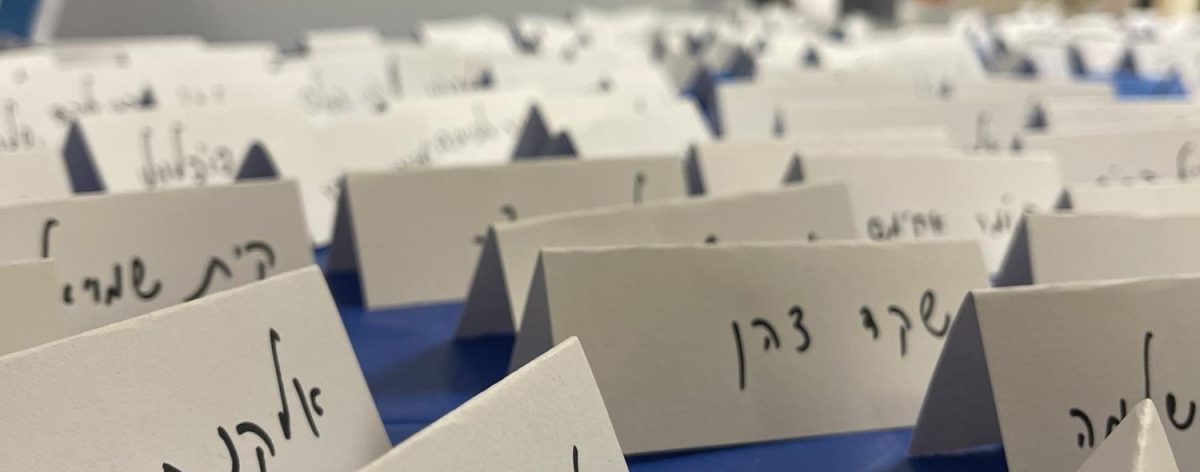 Names of Israeli hostages on a public table in the high school hallway.