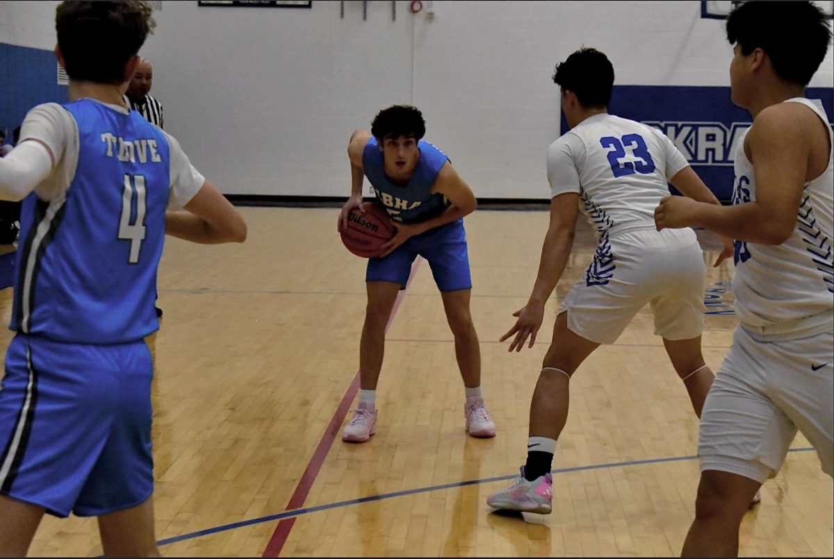 Senior David Wasserman is ready to attack the opposing defenders and make a play in a game of basketball against The Kansas School of the Deaf. Image taken by Avital Mullokandova
