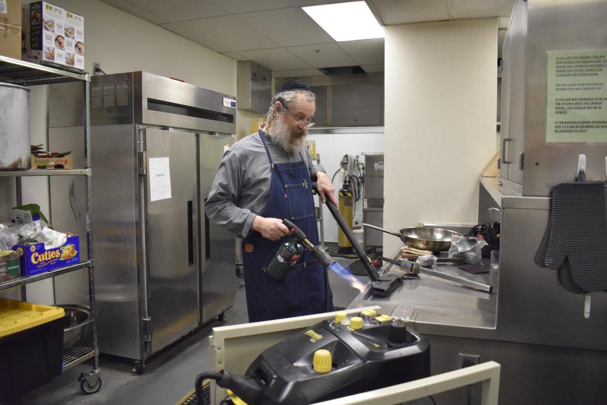 Kashering a kitchen might be the most underrated skill for young Jewish adults to learn. How are you going to eat when you buy a new house/apartment, stay at a hotel, or work in a workplace? This is why HBHA offered a Kashrut class to the 9th and 10th grade this year. Pictured above is Rabbi Shapiro of the Vaad HaKashruth of Kansas City kashering a kitchen. 
Photo by 
