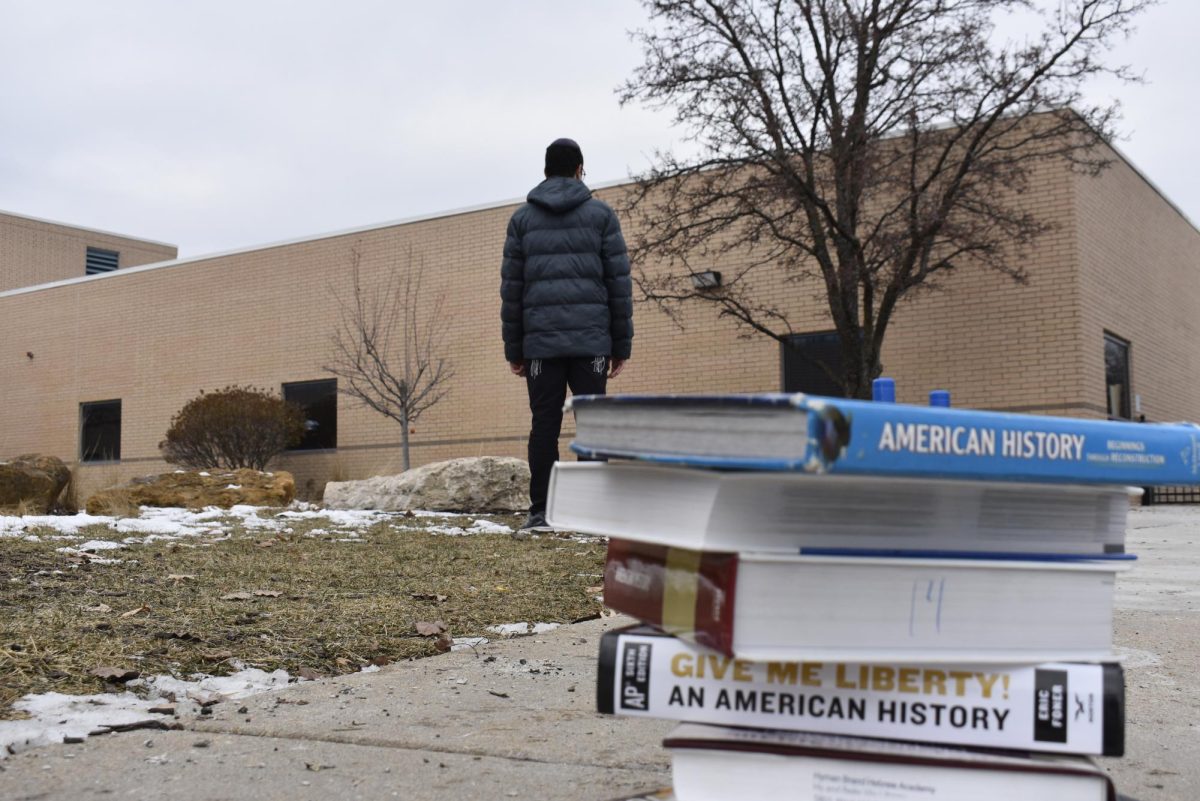 As a student turns his back on history textbooks, he represents the youth turning their backs on the past. Photo by Uriel Noorollah 