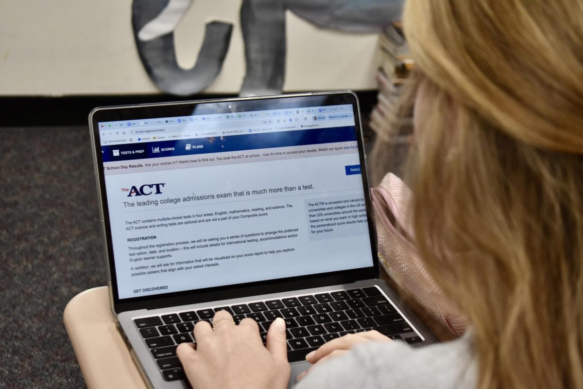 A student contemplates the ACT website, where you can find information about registration, testing locations, and scores. Photo by Rhys Pabst
