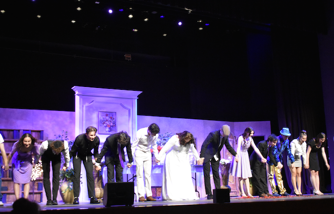Actors end their final performance with a bow, and applause from the audience erupting through out the theater. Photo by Rhys Pabst.
